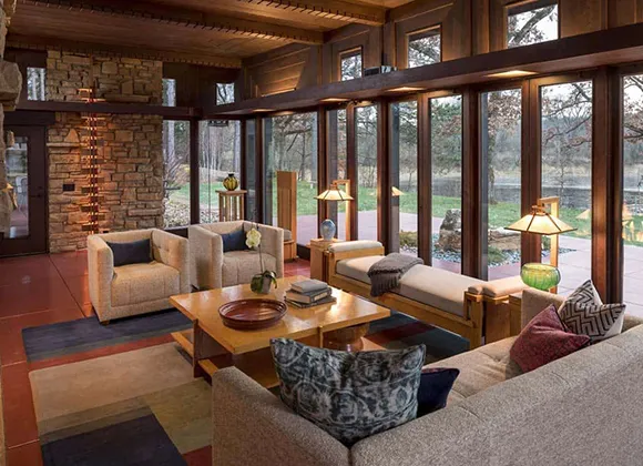 Modern dining area with large windows, representing trusted home buyers offering hassle-free real estate solutions.